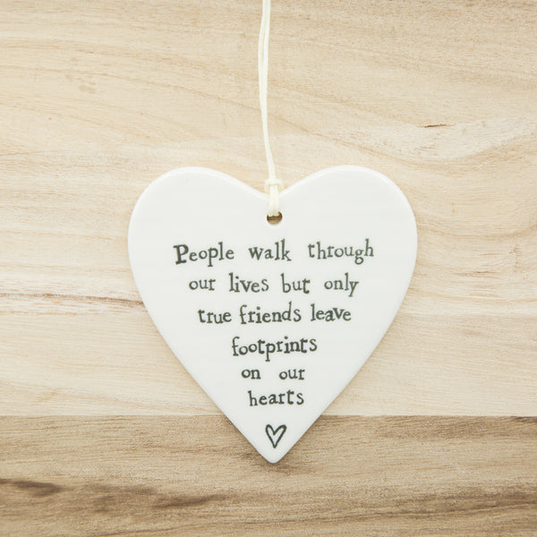 People walk through our lives but only true friends leave footprints on our heart
